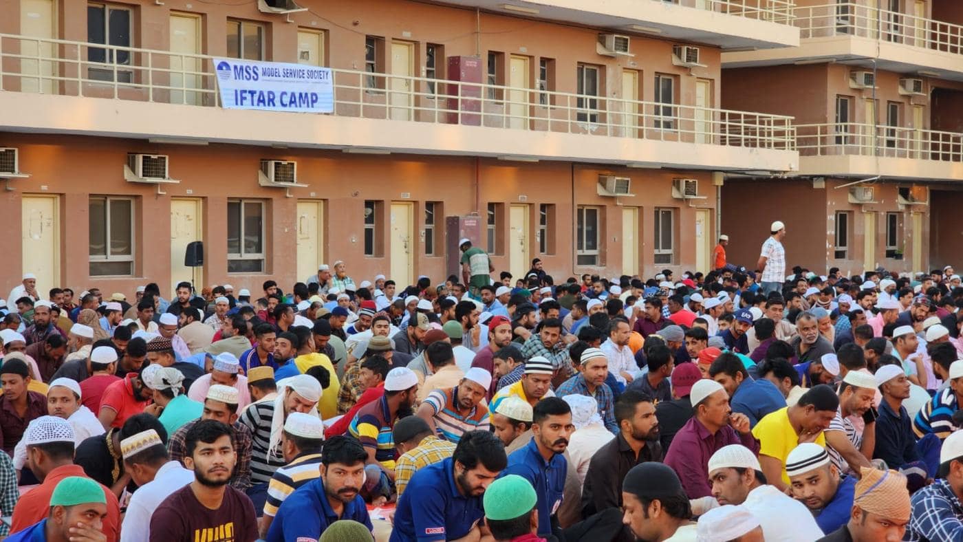 Workers sharing an MSS Iftar meal at a labour camp in Dubai